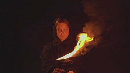 Female fakirs. A woman looks into the camera. Slow motion. High-quality 4K footage.