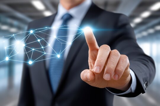 Businessman's finger touches a glowing digital network, symbolizing future tech.
