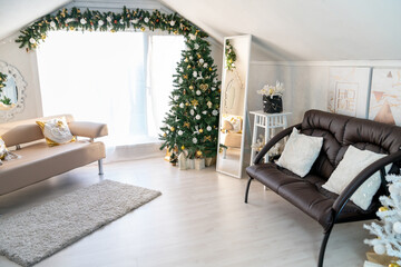Christmas interior of a bright living room. The attic. Daytime