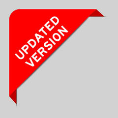 Red color of corner label banner with word updated version on gray background