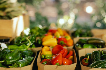 Fresh vegetables at small local urban market. Organic produce on sale at outdoor farmer market. Selling fresh crops and veggies harvest. European urban setting. Close up. Part of the series