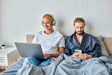 Happy memories of a joyful date shared between a loving gay couple in a cozy bedroom