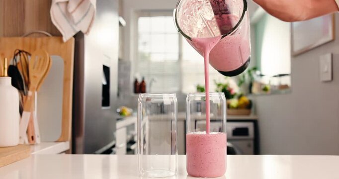 Pour, blender and smoothie with hands of person in kitchen for diet, detox and nutrition. Antioxidants, gut health and weight loss with man and drink in home for protein shake, fiber and vitamins