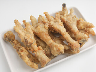 Fried chicken feet on white background