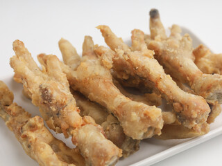Fried chicken feet on white background