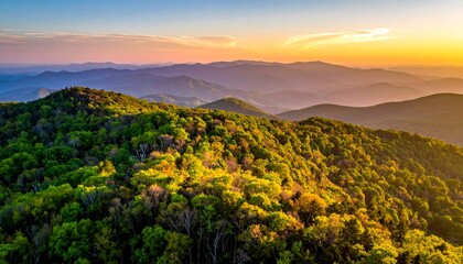 Obraz premium Verdant forested mountaintop view, layered hills receding into a golden-hued horizon during a vibrant sunset