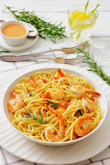 yummy spaghetti with shrimps in a white bowl