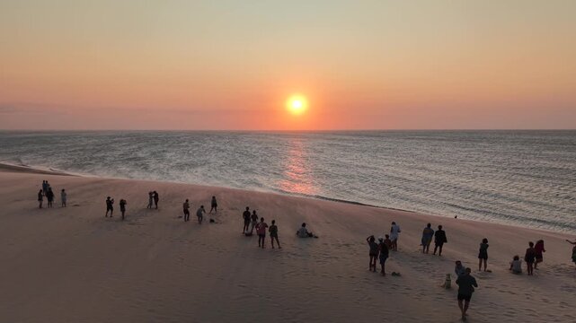 People watching the sunset from the top of a dune at Jericoacoara Beach - Jijoca de Jericoacoara, Cear&aacute;, Brazil