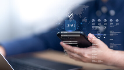 Two-factor authentication concept. User authentication on mobile and laptop devices uses secure...