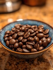 Fototapeta premium Roasted coffee beans fill a textured ceramic bowl on a kitchen counter showcasing their rich brown color and texture