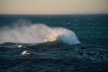 The waves rolling on the sea at dusk