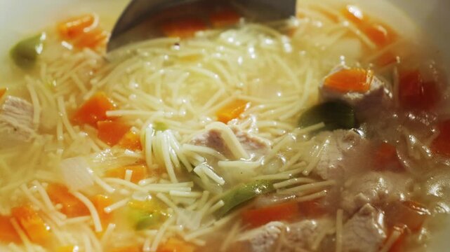 Chicken noodle soup with vegetables. The concept of homemade food.