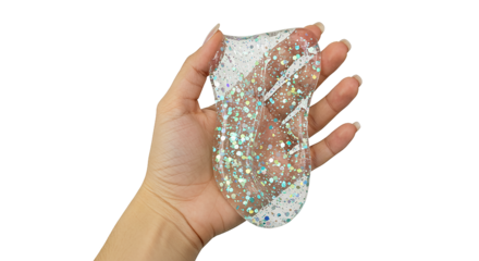 Hand Holding Clear Slime with Sparkling Glitter, a Fun and Sensory Activity, Isolated on White