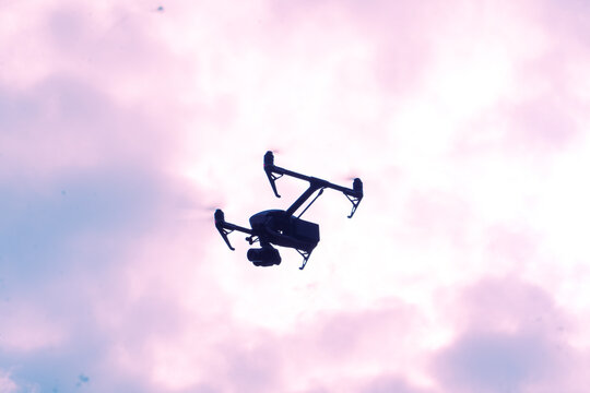 Professional drone shilquotte flying from sky