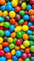 Close-up shot of numerous colorful, candy-coated chocolate pieces