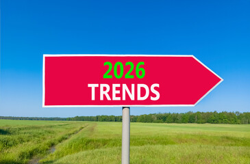 2026 Trends new year symbol. Concept words 2026 Trends on beautiful red road sign. Beautiful green grass field forest and blue sky background. Business and 2026 Trends new year concept. Copy space.