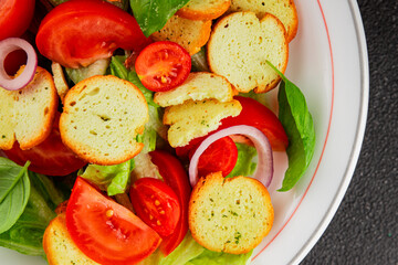 Panzanella salad tomato, croutons, onions vegetables dish natural product tasty snack fresh delicious gourmet food background on the table rustic top view copy space