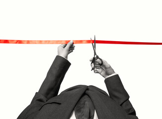 Scissors in hands cuts the red satin ribbon and colorful paper confetti is falling. Isolated on white background.