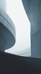 Abstract architectural composition featuring concrete curves and geometric shapes against a bright sky, emphasizing modern design and urban structure