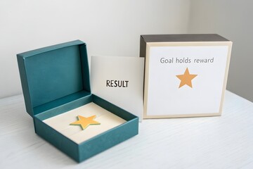 Star inside an open box symbolizing reward and success