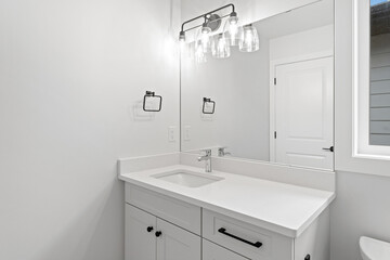 Bathroom with a white sink and a mirror