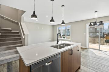 Kitchen with a white island and stainless steel appliances