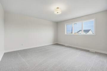 Large, empty room with a white ceiling and white walls
