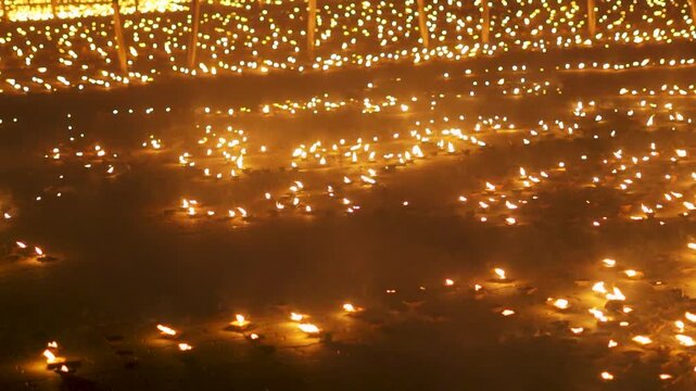 Illuminating Diyas at Hindu temple in India during Diwali festival. Diya oil lamps. Diwali, Hindu festival of lights celebration. Indian holiday. Deepotsav at Bhuj, Gujarat, India.