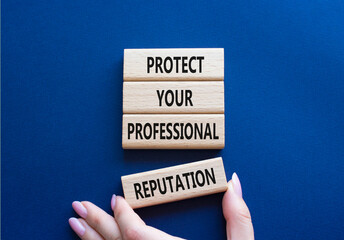 Professional Reputation symbol. Concept words Protect Your Professional Reputation on wooden blocks. Beautiful deep blue background. Businessman hand. Business concept. Copy space