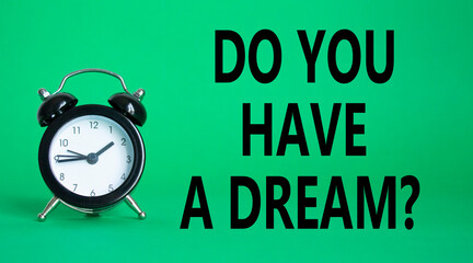Do you have a Dream symbol. Beautiful green background with alarm clock. Business and Do you have a Dream concept. Copy space.