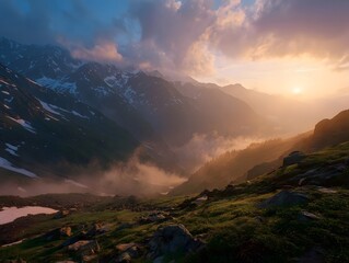 A majestic mountain landscape bathed in the warm glow of sunrise with mist filling the valleys and clouds painting the sky