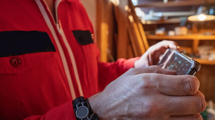 Close-up of a man's hands holding a smartphone