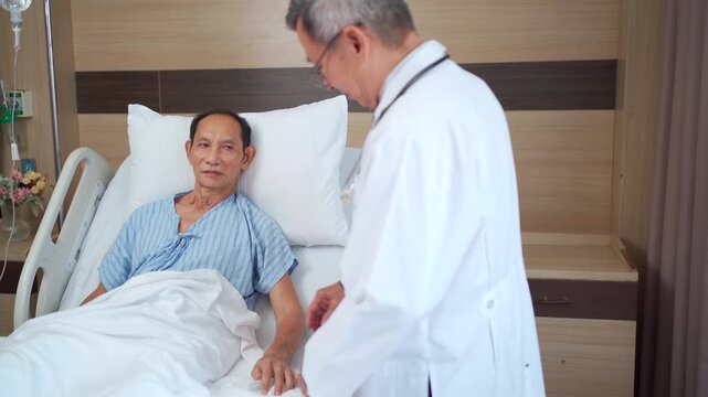 Doctor comforting elderly patient in hospital recovery room.