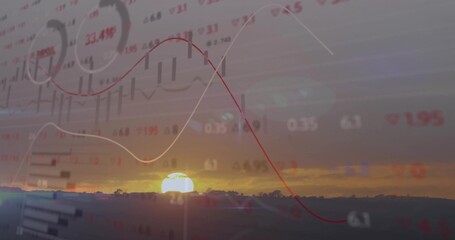 Obraz premium Displaying golden sun rising above hills at dusk silhouetted trees overlaying financial data graphs