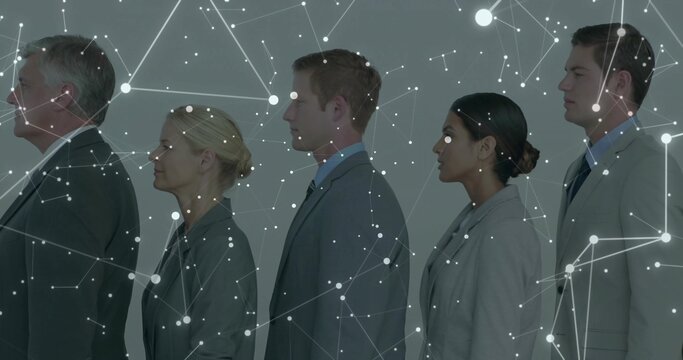 Standing five colleagues in profile in studio, with glowing network nodes and connecting lines - Powered by Adobe