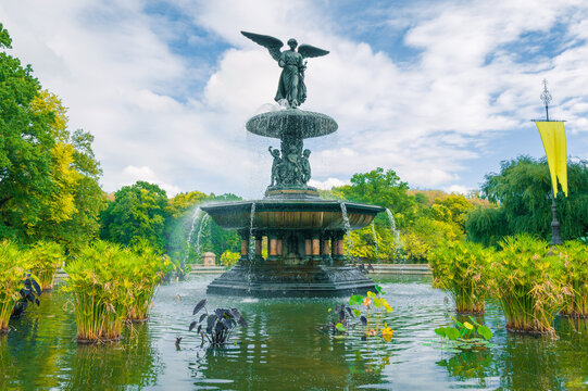 Central Park Bethesda Fountain with autumn trees and colorful leaves. New York. USA