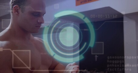 Shirtless boxer wrapping white hand wraps in gym, with hologram, wall pads, orange sign, copy space