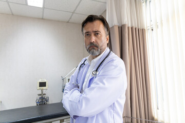 Confident medical team standing in hospital room