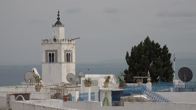Skyline of picturesque town of Sidi bou Said, with village mosque in center. Tourism and historic landmarks in Tunisia.