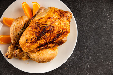 Baked chicken with oranges whole grilled chicken christmas holiday dish new year natural product tasty snack fresh delicious gourmet food background on the table rustic top view copy space