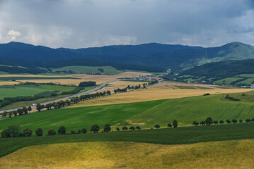 Obraz premium Landscape with green fields and blue sky