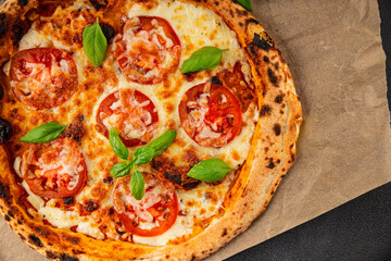 Pizza tomato margarita fast food natural product tasty snack fresh delicious gourmet food background on the table rustic top view copy space