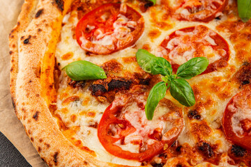 Pizza tomato margarita fast food natural product tasty snack fresh delicious gourmet food background on the table rustic top view copy space