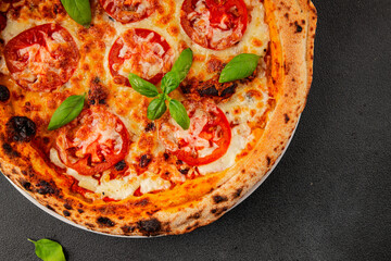 Pizza tomato margarita fast food natural product tasty snack fresh delicious gourmet food background on the table rustic top view copy space