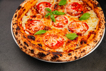 Pizza tomato margarita fast food natural product tasty snack fresh delicious gourmet food background on the table rustic top view copy space