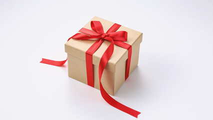 Gift box with red ribbon bow isolated on white background, clipping path included