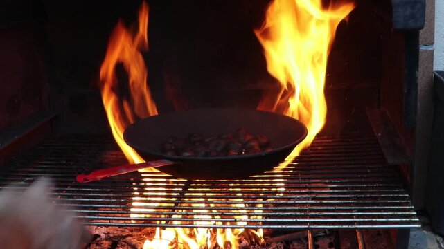 La Castanyada, the Catalan Halloween: eating chestnuts cooked on the barbecue