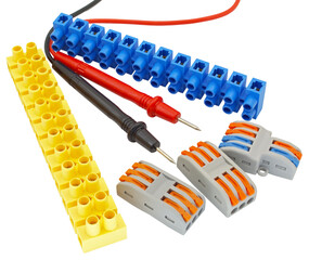 electrical terminal blocks and multimeter probes on white