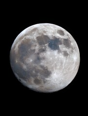 Obraz premium Close up view of the full moon s detailed surface with visible craters against a dark background