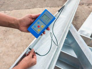 Measure the Coating Thickness Galvanized with a Coating Thickness Gauge by Specification of Project for Steel Structure Work at Industrial Factories.